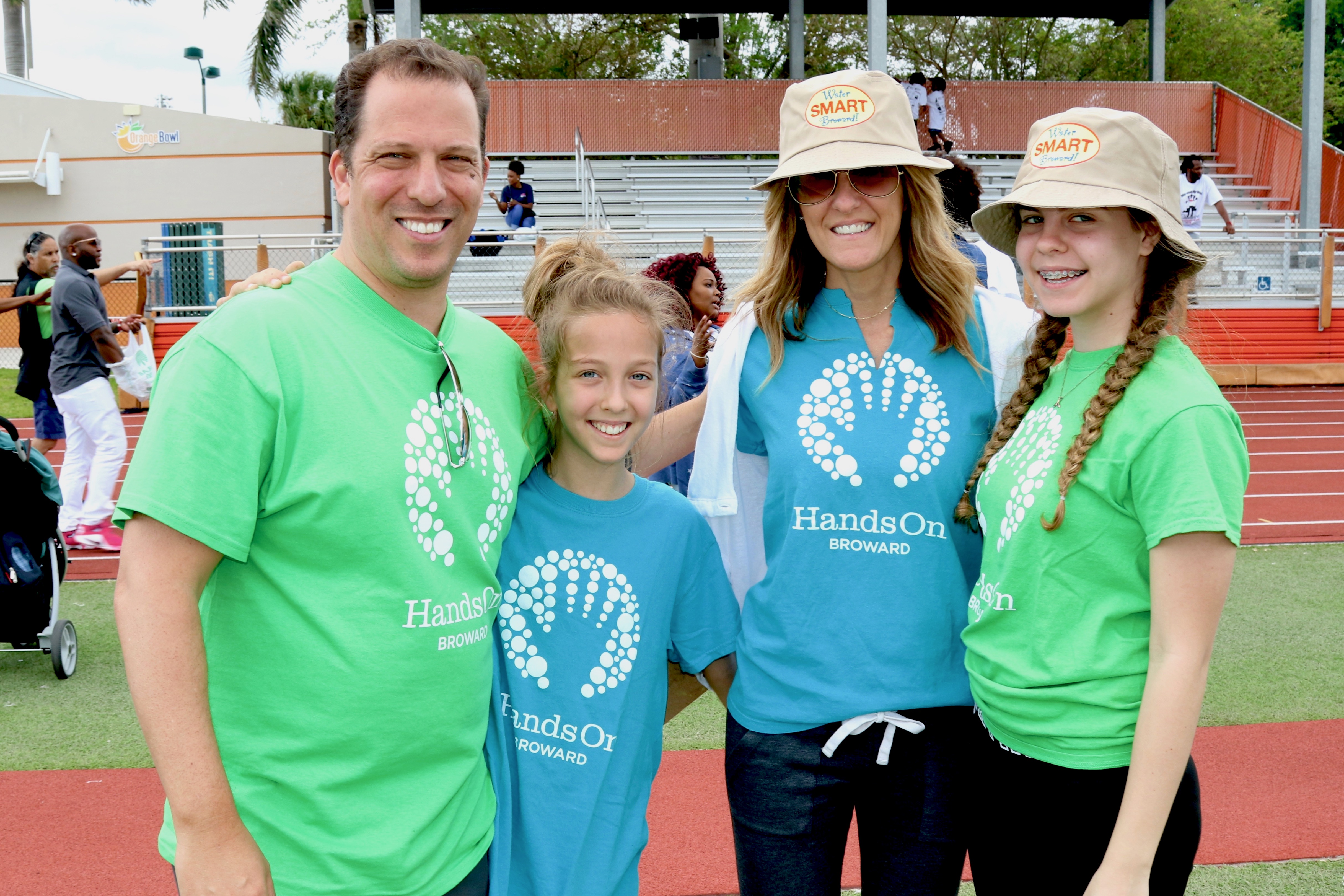 Helping others through volunteering - an image with four people smiling