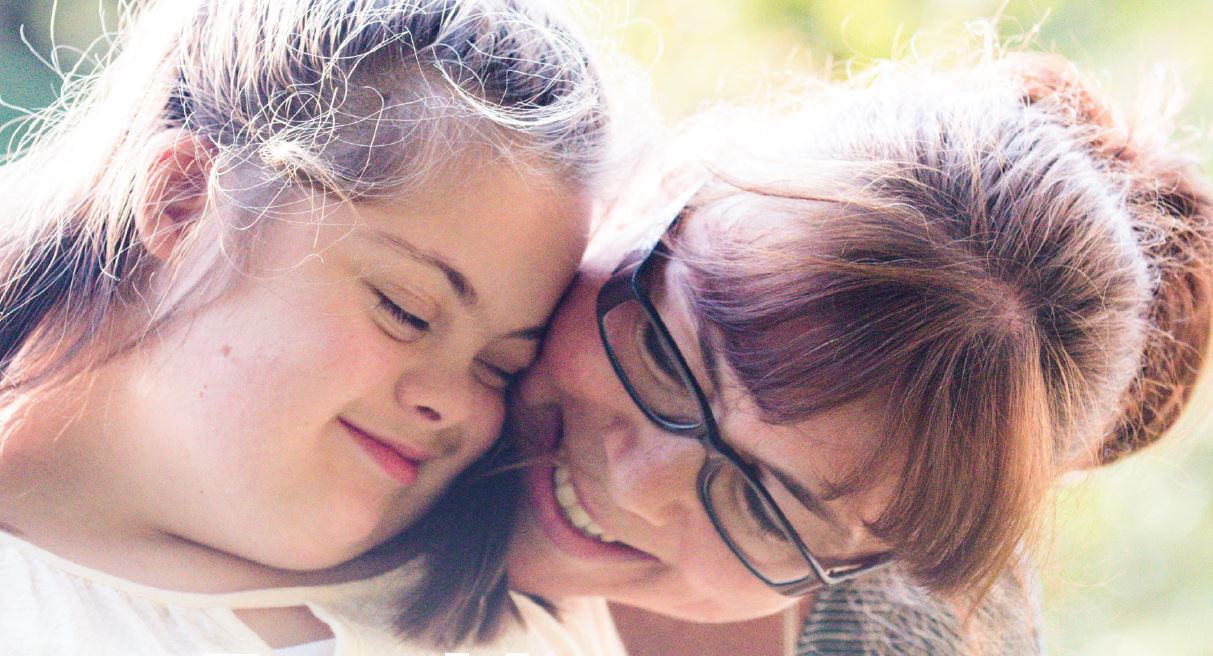 Mother and Child hugging and laughing 