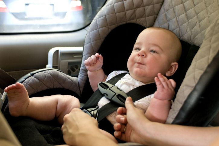 Baby in car seat.