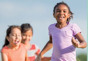 Girls running together and laughing 