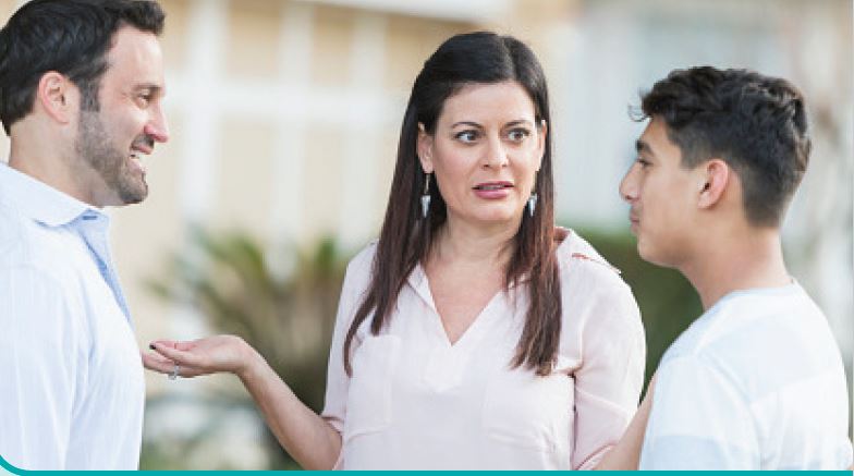 father, mother and son having a conversation