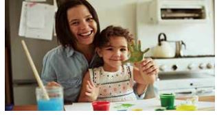 mother and her child doing painting together