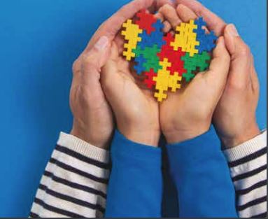 mother and child making a heart with the puzzle colors for Autism